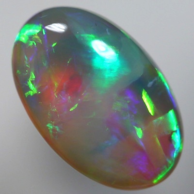 SOLID CRYSTAL OPAL Large bright chasing rolling flashes of rich orange and green